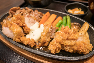 japanese style fried chicken and pork on plate