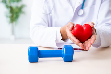 Young male doctor in sport and dieting concept