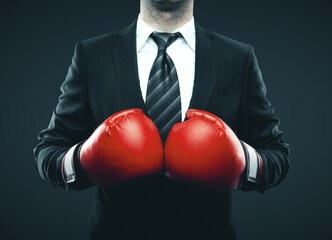 Businessman in red boxing gloves