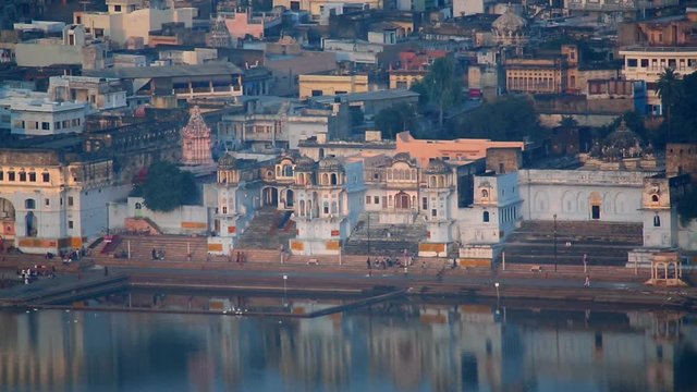 Unidentified Indian people at ritual washing in the sacred Sarovar lake. Pushkar - famous worship place in India