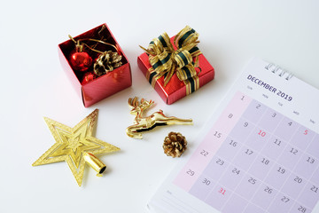 Gift boxes collection and  decorations and calendar with calendar isolated on white background. Christmas's day concept.