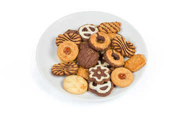 Different shortbread cookies on dish on a white background