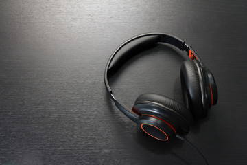 headphones on black table or background. flat lay. table top view. copy space. - musical concept