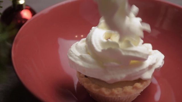Whipped cream topping over mince pie at Christmas