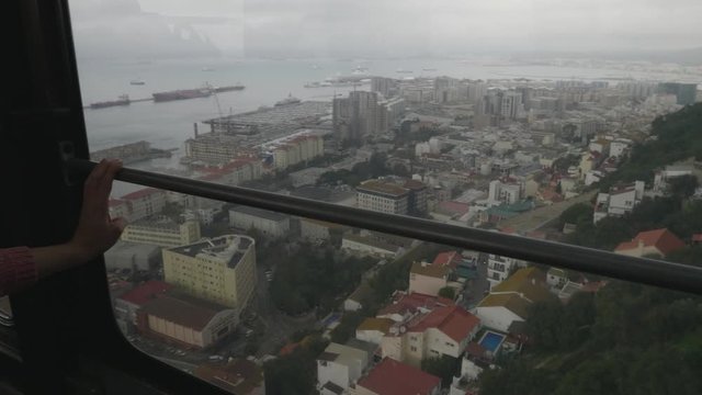 POV Shot of Gibraltar from inside of cable car on a foggy day.