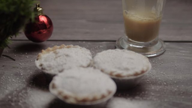 Mince pies and serving of coffee in Christmas background