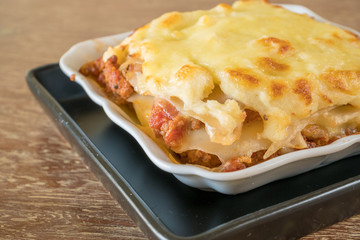 italian style minced beef bolognese sauce lasagna on table