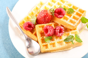 delicious wafffles with berry fruit and sugar
