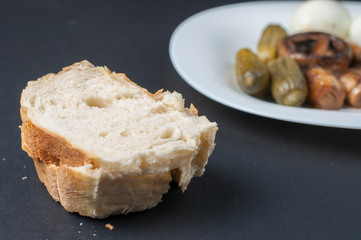 Mushrooms and boiled eggs on a white plate isolated on a black background.Natural food