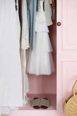 women's clothing in a pink wardrobe