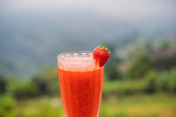 The traditional strawberry juice in Bali in the Bedugul area. Cafe on a strawberry plantation Bali. A popular destination in tourism. Attraction of Bali