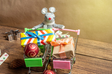 Naklejka premium Cute gray rat toy with gift present box shopping cart toys symbol new year