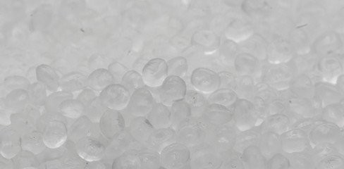 Polypropylene granule close-up background texture.