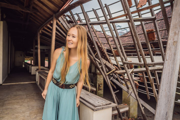 Woman tourist in abandoned and mysterious hotel in Bedugul. Indonesia, Bali Island. Bali Travel...
