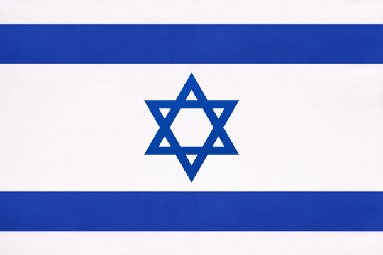 Israel national fabric flag, textile background. Symbol of international world east country.