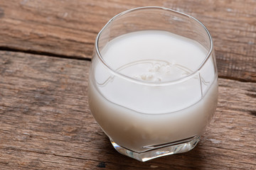 Barley water in glass with raw and cooked