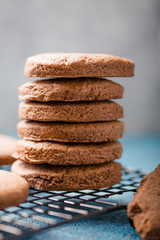 Pile of Delicious Chocolate Chip Cookies on a  board with Milk Bottles