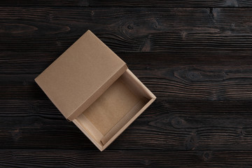 Cardboard box on a wooden background