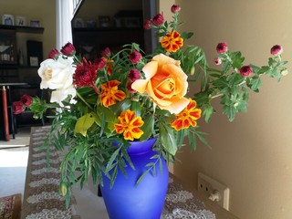 bouquet of flowers in a vase on wooden table,decor