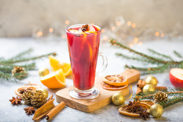 Christmas mulled wine delicious holiday like parties with orange cinnamon star anise spices. Traditional hot drink or beverage, festive cocktail at X-mas or New Year .