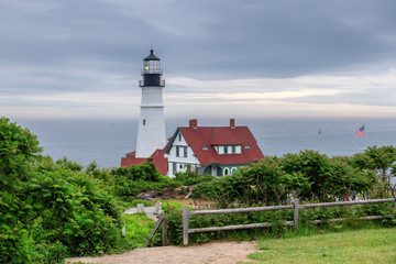 Fototapeta na wymiar Portland Head Lighthouse at morning dramatic sky in Cape Elizabeth, Maine, USA.