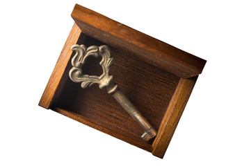 Old key and wooden chest on white background.