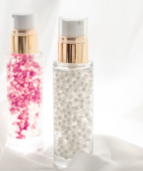Skincare serum and make-up primer gel bottle, moisturizing lotion and lifting cream emulsion,...