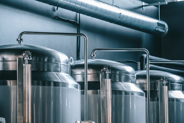 Craft beer brewing equipment in brewery! Metal tanks, alcoholic drink production