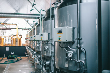 Craft beer brewing equipment in brewery! Metal tanks, alcoholic drink production
