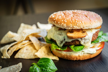 Delicious vegan falafel burger, cheese made from cassava and mushrooms. Healthy veggie vegetarian sandwich with no animal derivatives.