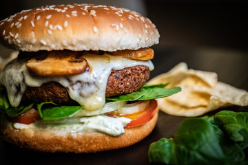 Delicious vegan falafel burger, cheese made from cassava and mushrooms. Healthy veggie vegetarian sandwich with no animal derivatives.