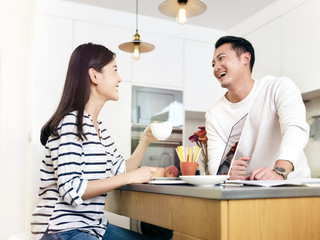 young asian couple working at home