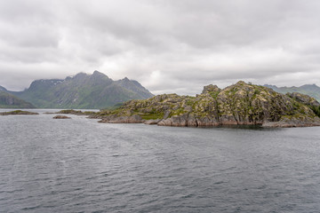 Fototapeta na wymiar green cliffs at southern end of Raftenfjord, Norway