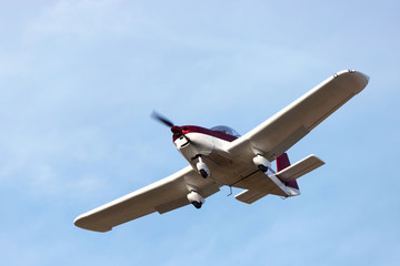 sports airplane flying mid air
