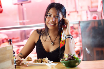 asian girl eating in the japanese restaurant