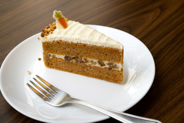Carrots, cream cheese cake on the table