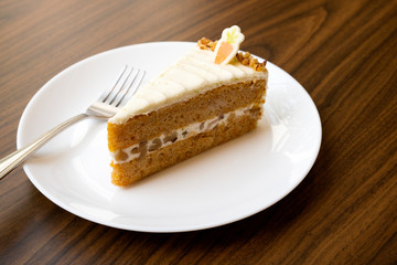 Carrots, cream cheese cake on the table