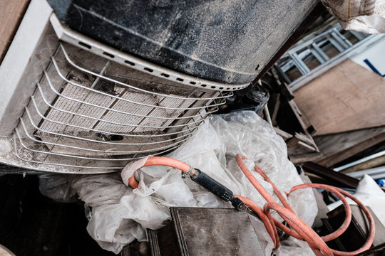 Metal Scrap Seen Abandoned At A Builders Yard Showing A Gas Heater And Pipework