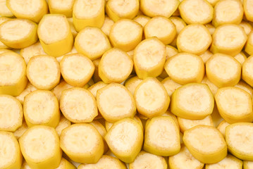 Fresh banana slices background. Top view.