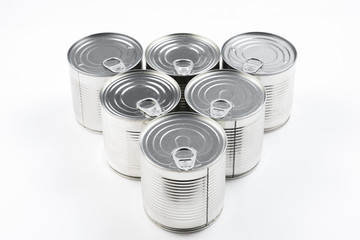 Group of silver canned food on white background.
