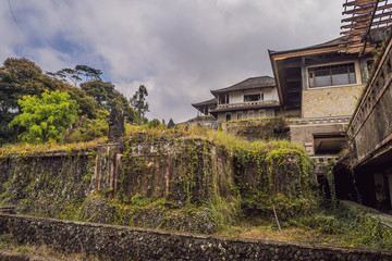 Fototapeta na wymiar Abandoned and mysterious hotel in Bedugul. Indonesia, Bali Island