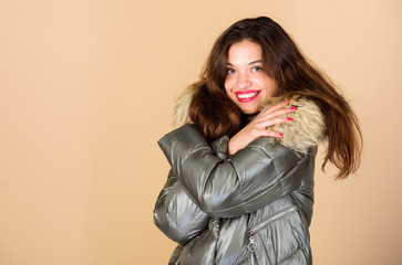Holyday atmosphere. woman in padded warm coat. girl in puffed coat. faux fur fashion. flu and cold. seasonal fashion. happy winter holidays. beauty in winter clothing. cold season shopping