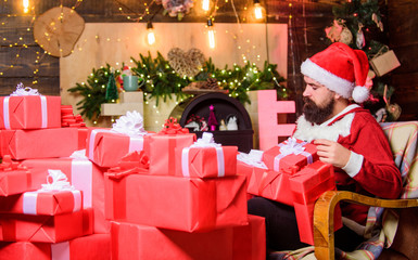 bearded man. happy new year. Xmas present box. hipster santa hat. Christmas shopping. winter shopping sales. Cheerful elf. christmas gift delivery. Cyber Monday