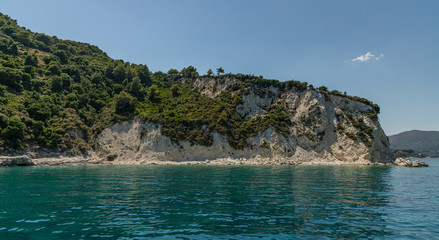 Fototapeta na wymiar rocky cliff with bushes on zakynthos