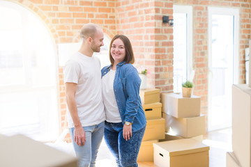 Fototapeta na wymiar Young couple together smiling happy moving to a new house