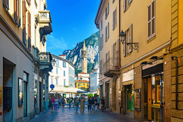 Lecco street with bell-tower of Basilica - obrazy, fototapety, plakaty