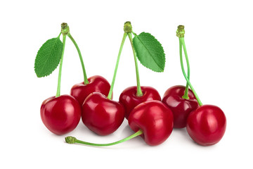 Some cherries with leaf closeup isolated on white background