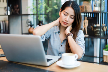 Asian woman working and drink coffee in cafe with laptop computer smile and happy work