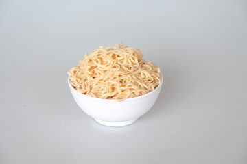 close up instant noodle with white bowl on white background 