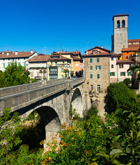 Fototapeta na wymiar Devils bridge with cathedral at the background. Cividale del Friuli. Italy